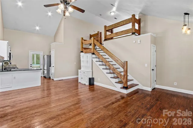 a view of an entryway with wooden floor