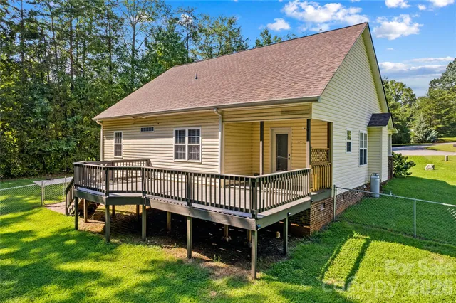 a front view of a house with a yard table and chairs