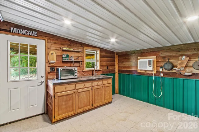 a kitchen with lots of counter space and a window