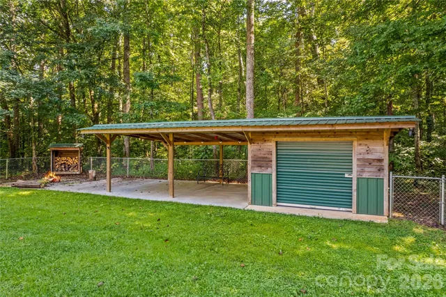 a view of a backyard with a garden and entertaining space
