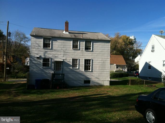 2408 Sheraton Street Silver Spring, MD 20906 - Photo 2 of 11 a front view of a house with a garden