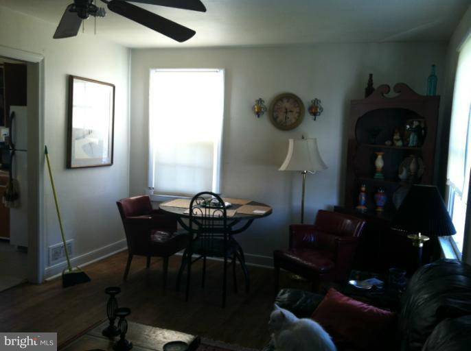 2408 Sheraton Street Silver Spring, MD 20906 - Photo 4 of 11 a view of a dining room with furniture and chandelier