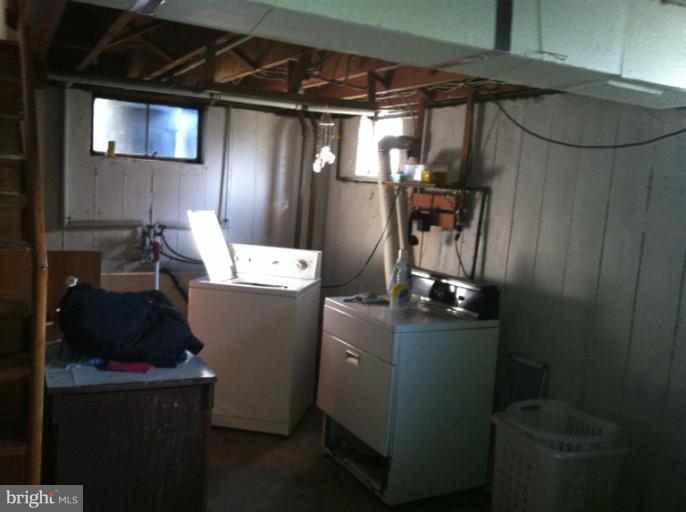 2408 Sheraton Street Silver Spring, MD 20906 - Photo 10 of 11 a room with water heater and utility racks