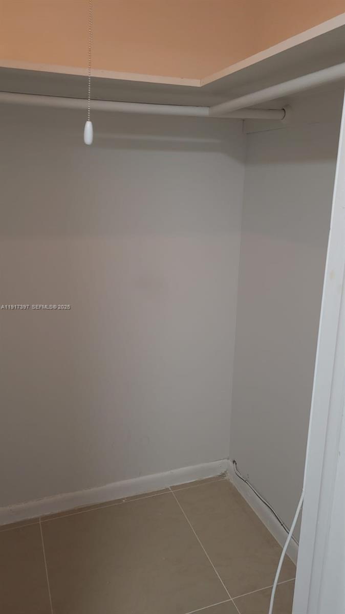 57 Cambridge C, Unit 57 West Palm Beach, FL 33417 - Photo 12 of 36 a view of a closet