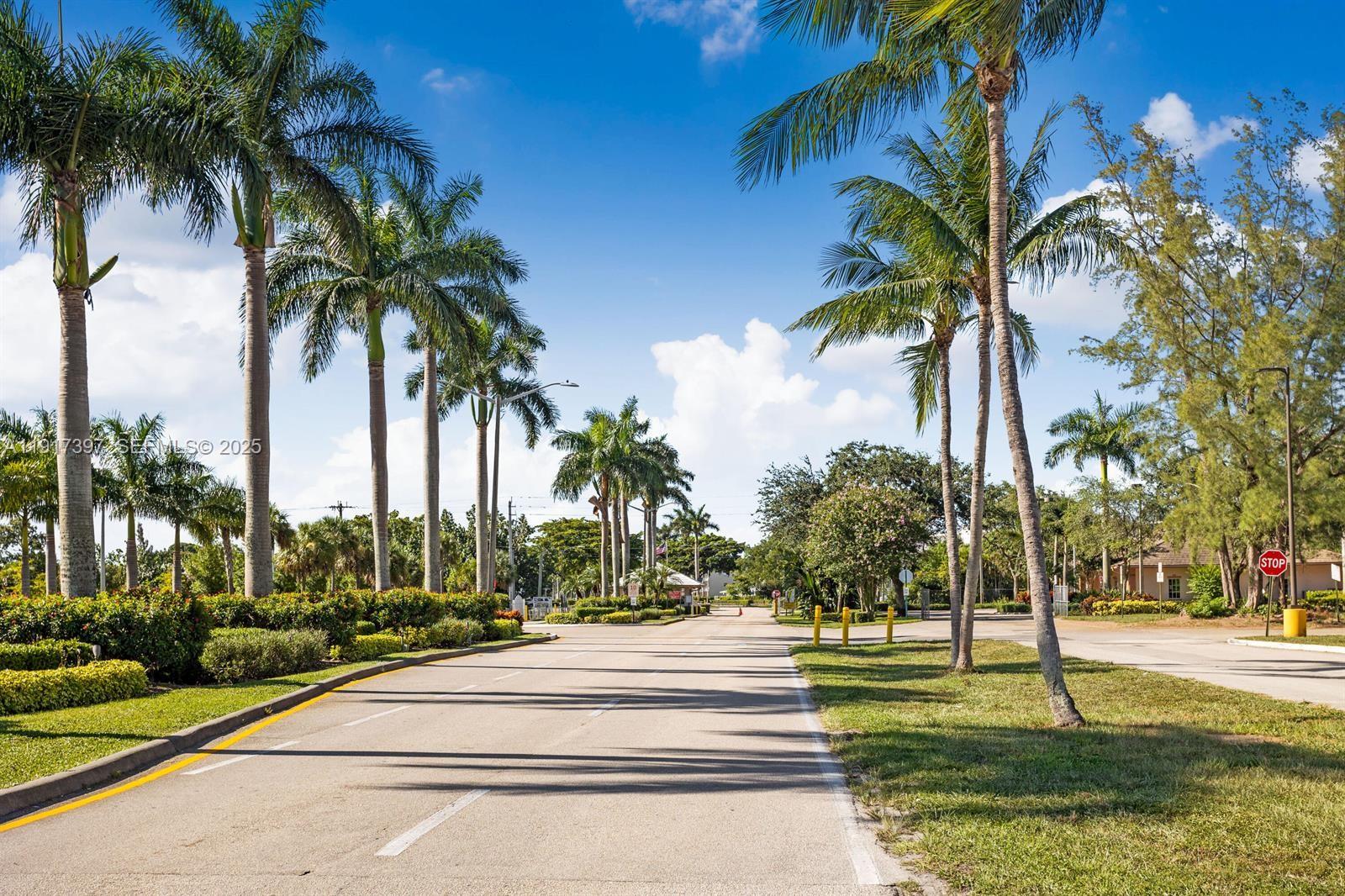 57 Cambridge C, Unit 57 West Palm Beach, FL 33417 - Photo 25 of 36 a park with palm trees