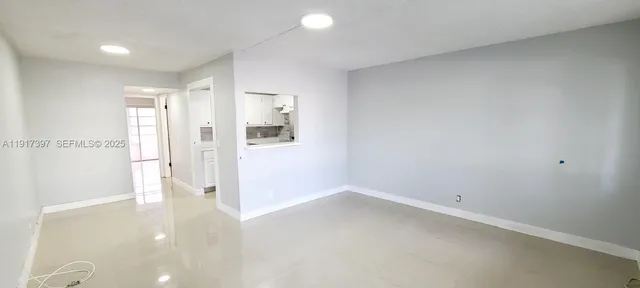 a view of a room with a hallway