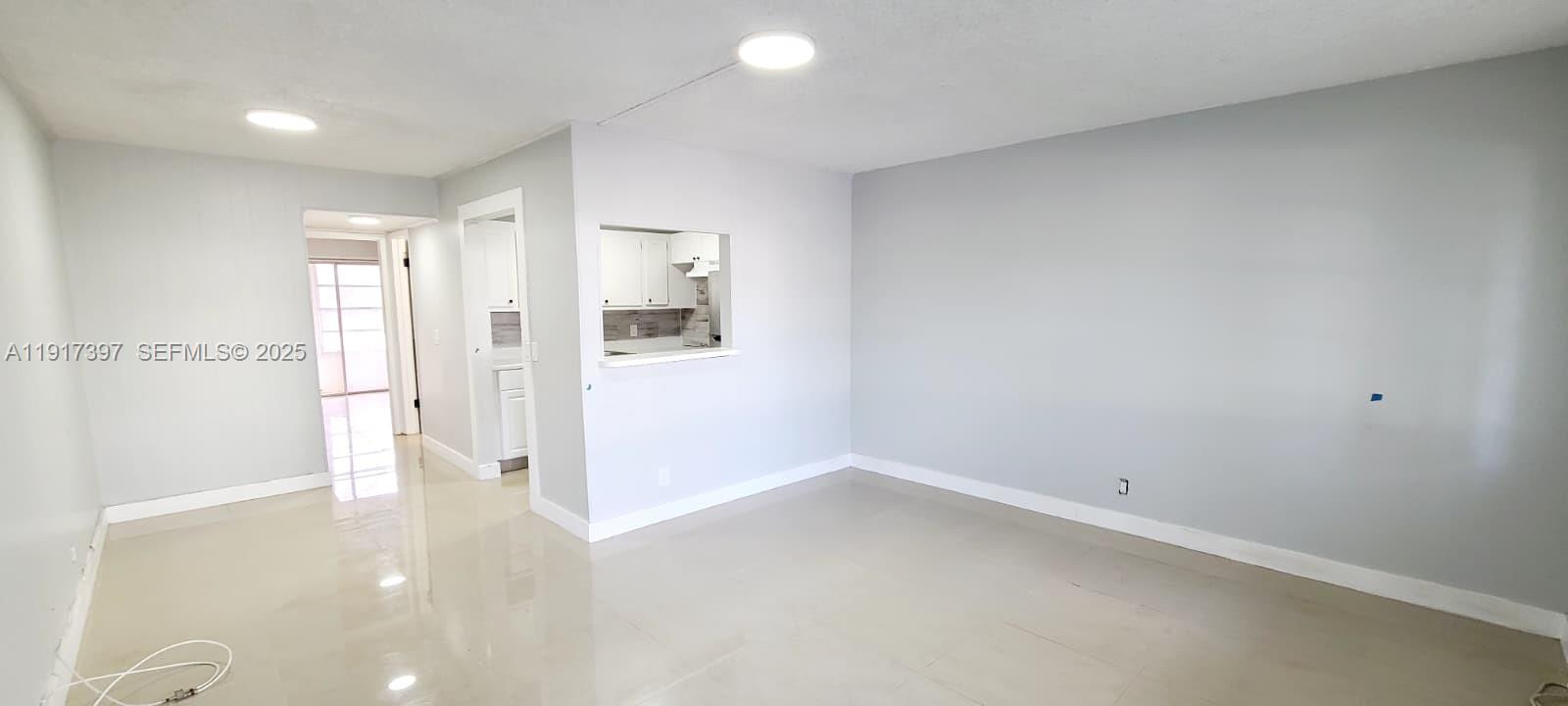 57 Cambridge C, Unit 57 West Palm Beach, FL 33417 - Photo 3 of 36 a view of a room with a hallway