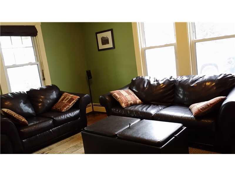 23 Harding Street Biddeford, ME 04005 - Photo 7 of 18 Living Room. Sunny Living room with...