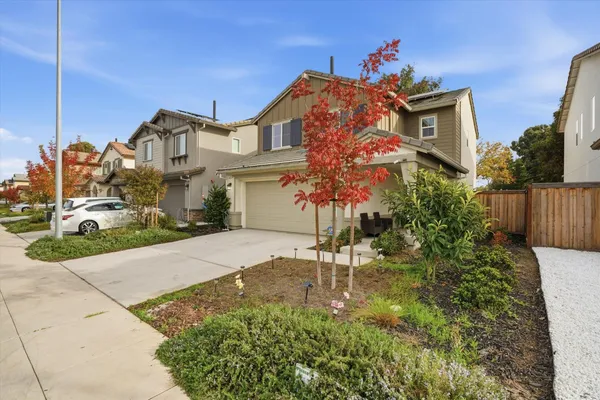 a front view of a house with a yard