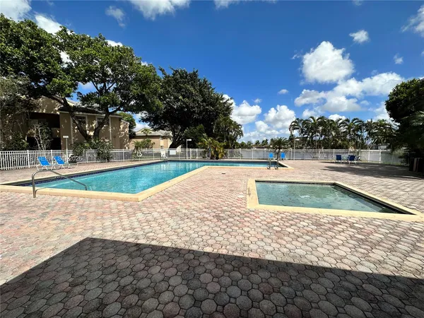 a view of a swimming pool with an outdoor space