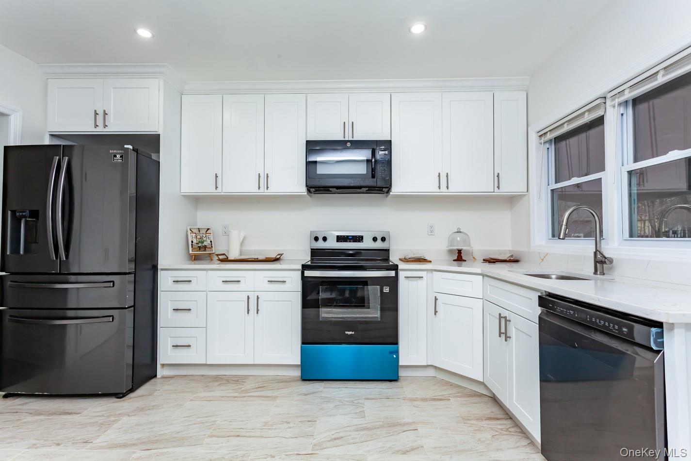 15 Waring Road Newburgh, NY 12550 - Photo 11 of 42 a kitchen with cabinets stainless steel appliances and a counter space