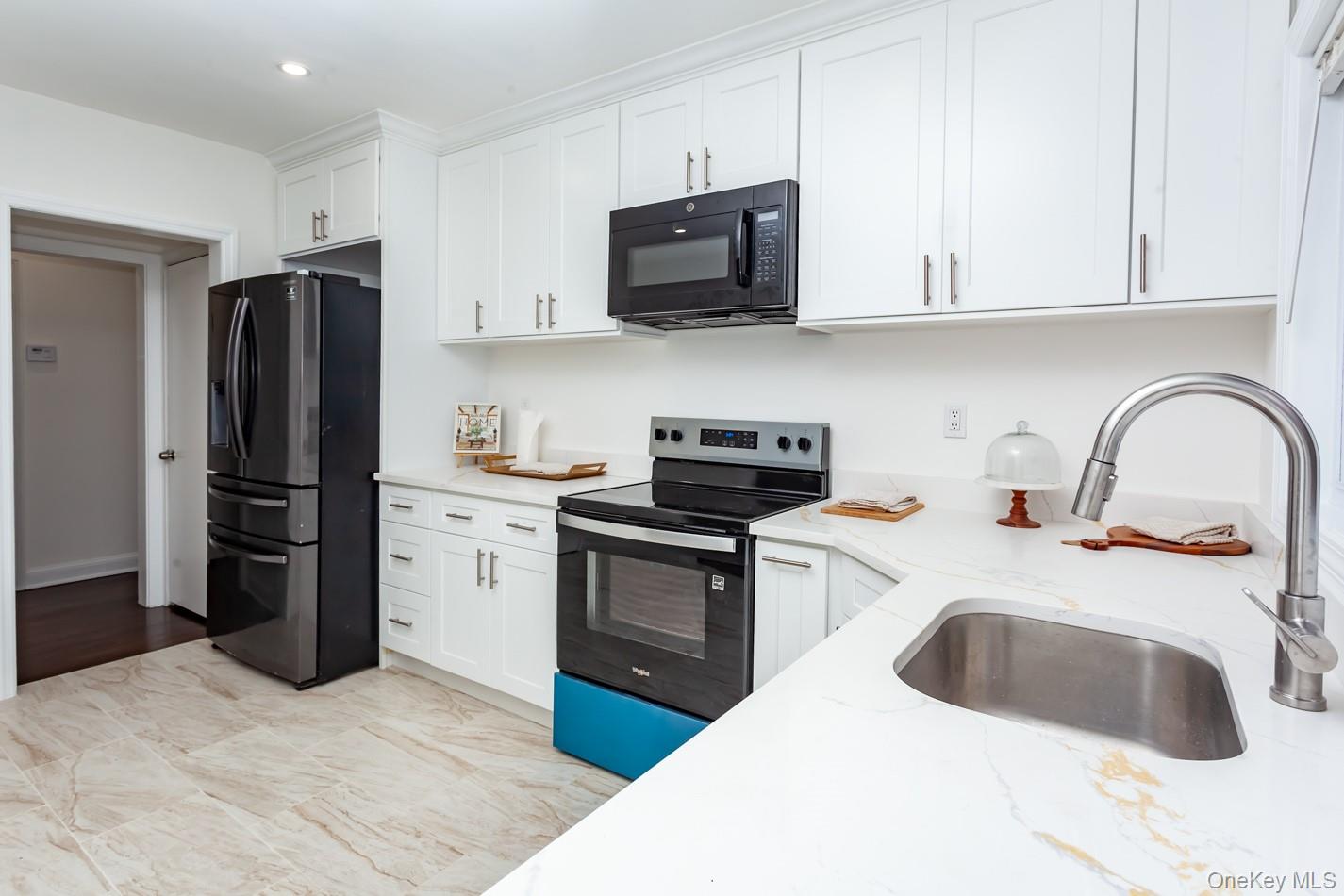15 Waring Road Newburgh, NY 12550 - Photo 12 of 42 a kitchen with stainless steel appliances granite countertop a refrigerator stove top oven a sink and dishwasher