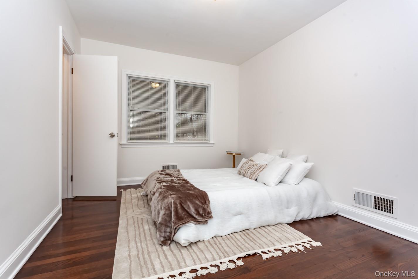 15 Waring Road Newburgh, NY 12550 - Photo 20 of 42 a bedroom with a bed and a window