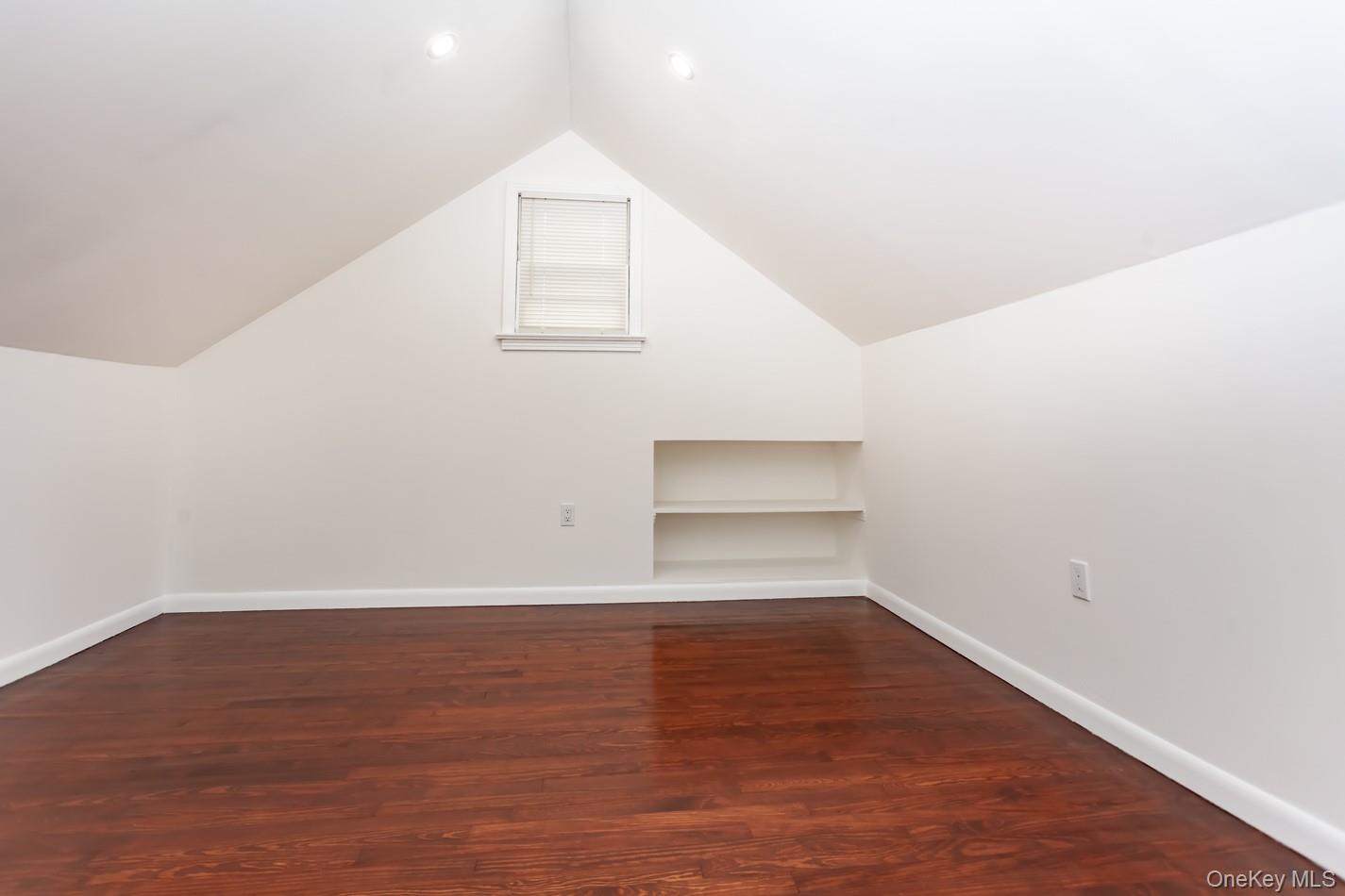 15 Waring Road Newburgh, NY 12550 - Photo 22 of 42 a view of an empty room with wooden floor and a window