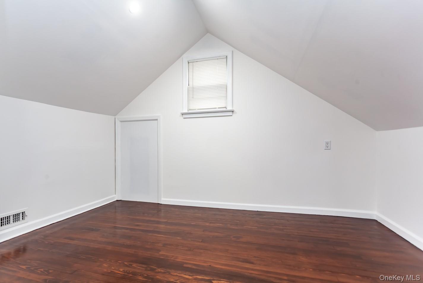 15 Waring Road Newburgh, NY 12550 - Photo 28 of 42 a view of an empty room with wooden floor and white walls