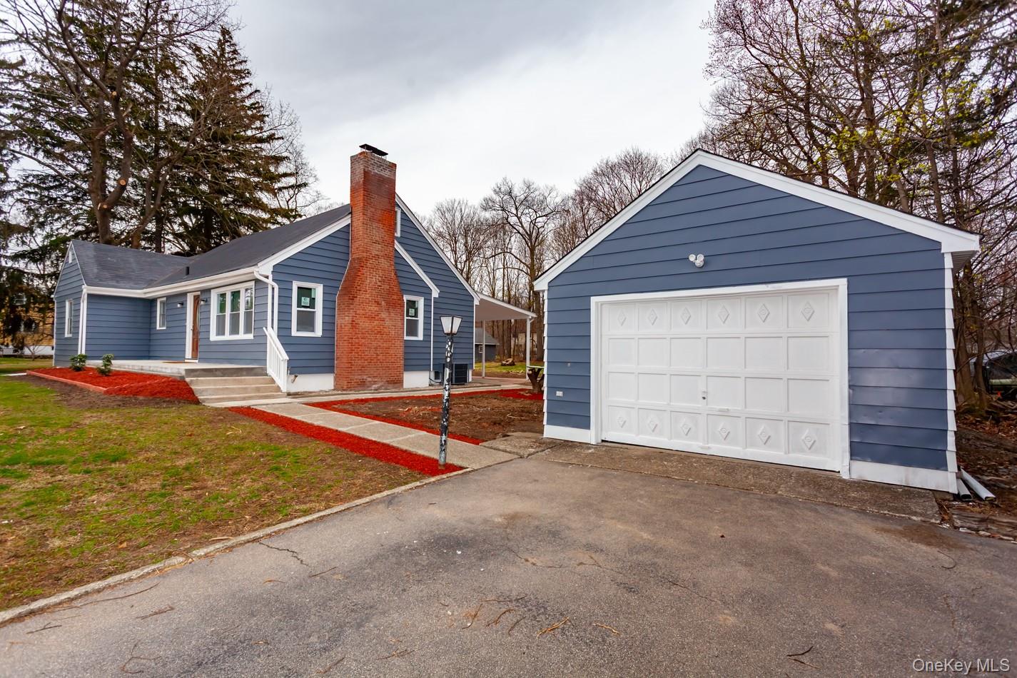 15 Waring Road Newburgh, NY 12550 - Photo 38 of 42 a view of a house with a yard and garage
