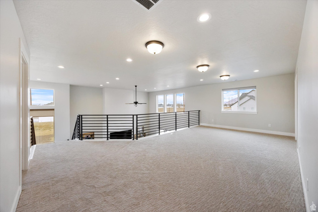754 West 400 North, Unit 29 Mapleton, UT 84664 - Photo 19 of 25 Carpeted spare room with a ceiling fan and recessed lighting