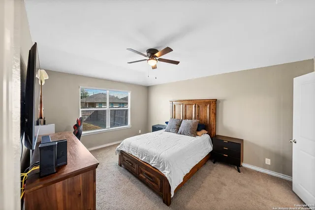 a bedroom with a bed and a couch