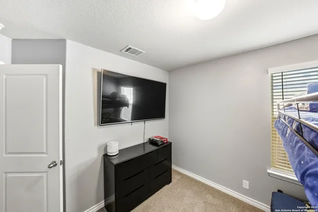 a room with furniture and a flat screen tv