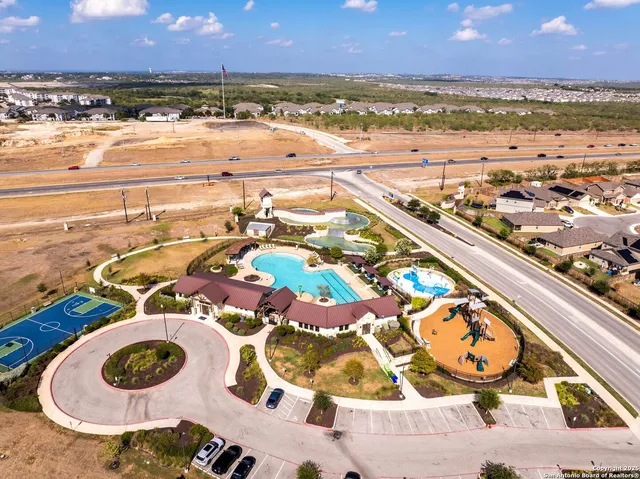 an aerial view of a swimming pool and outdoor space