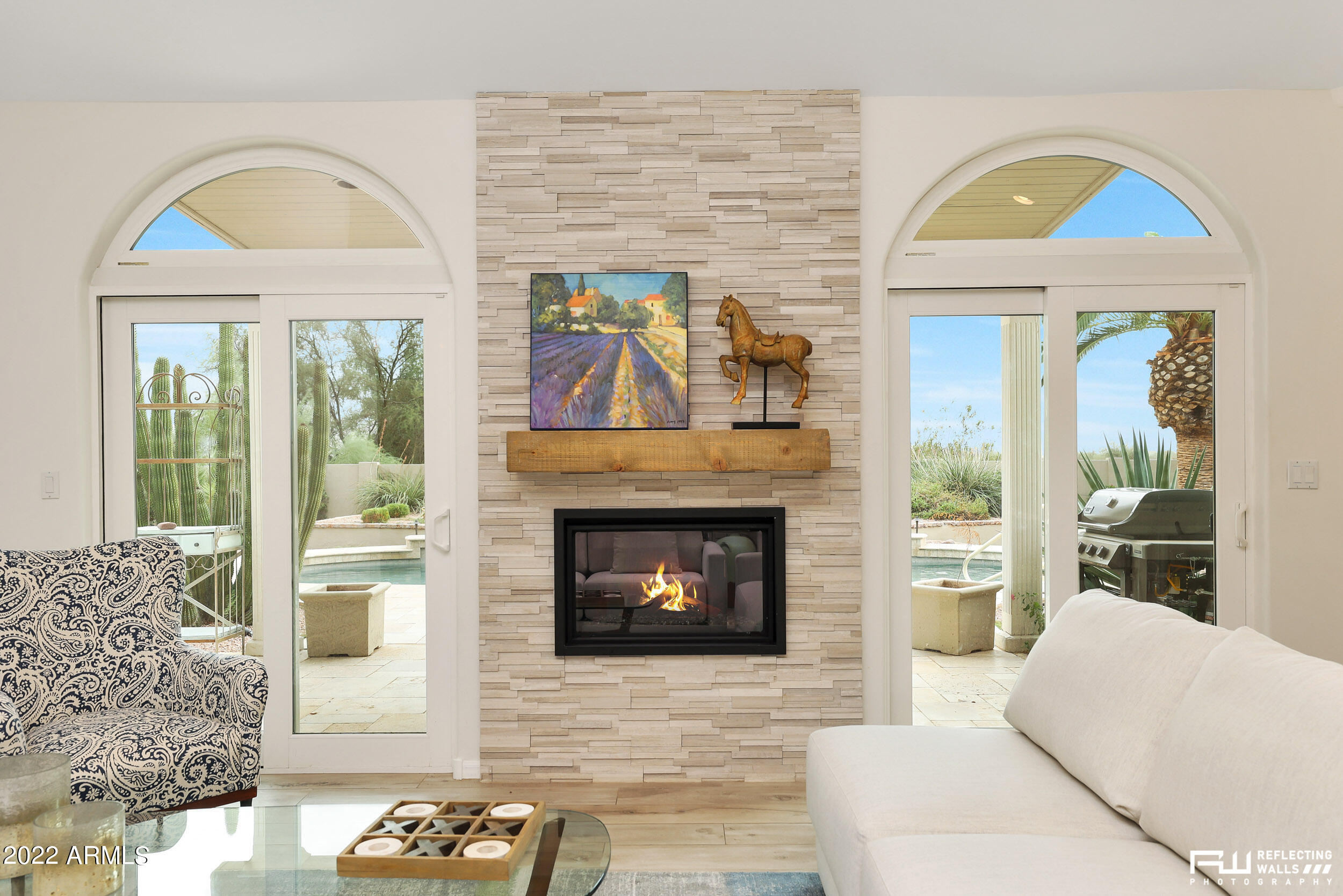 10085 East Doubletree Ranch Road Scottsdale, AZ 85258 - Photo 11 of 62 a living room with furniture and a fireplace