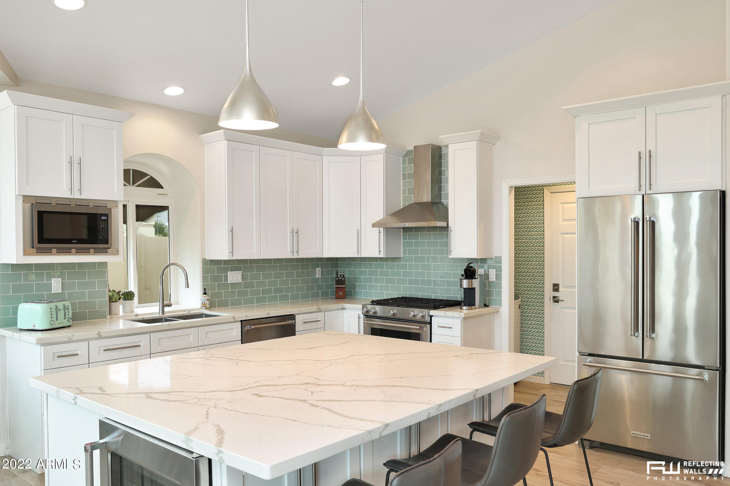 10085 East Doubletree Ranch Road Scottsdale, AZ 85258 - Photo 15 of 62 a kitchen with stainless steel appliances granite countertop a refrigerator a sink a stove and a cabinets