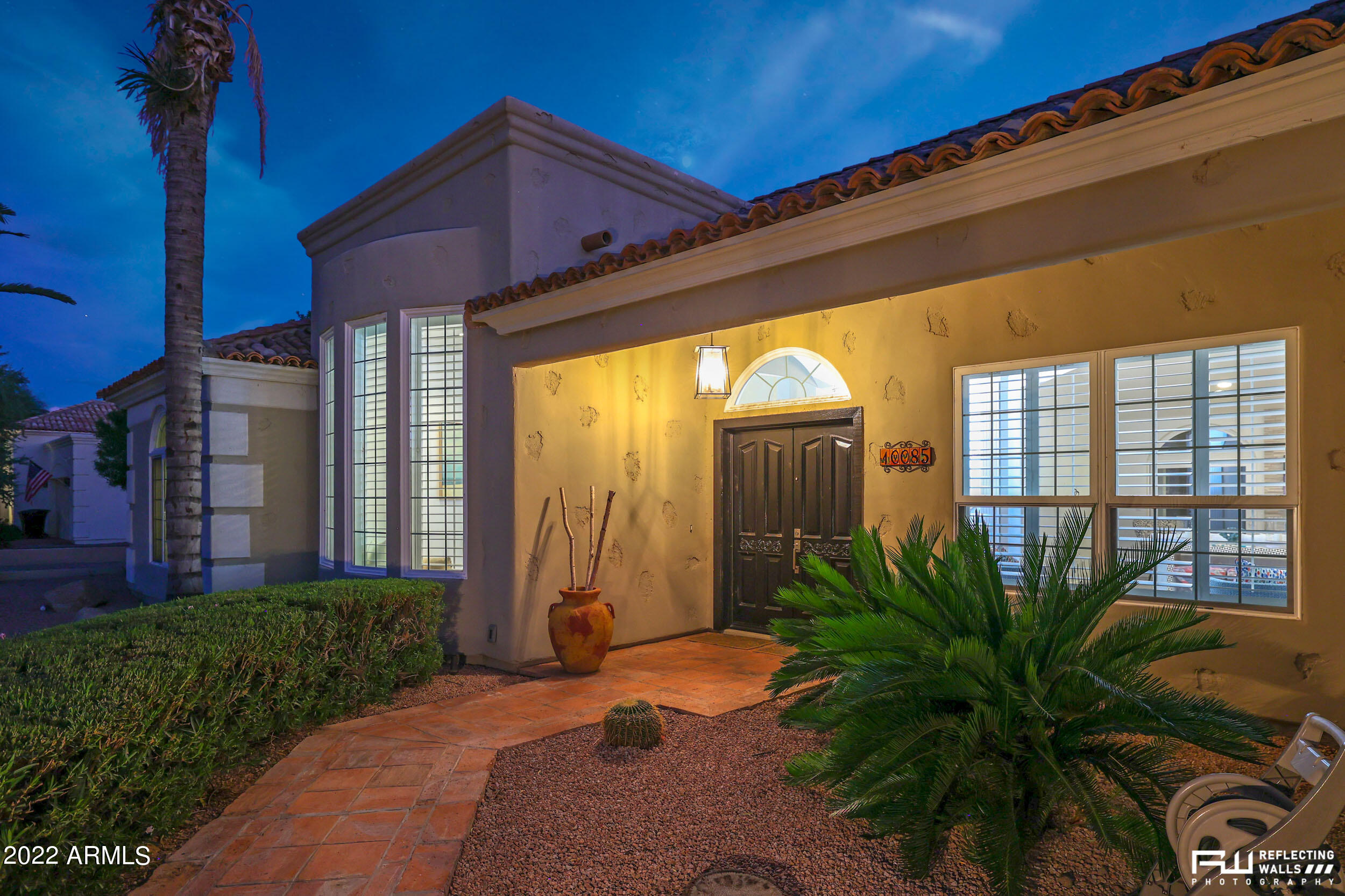 10085 East Doubletree Ranch Road Scottsdale, AZ 85258 - Photo 2 of 62 a front view of a house with garden