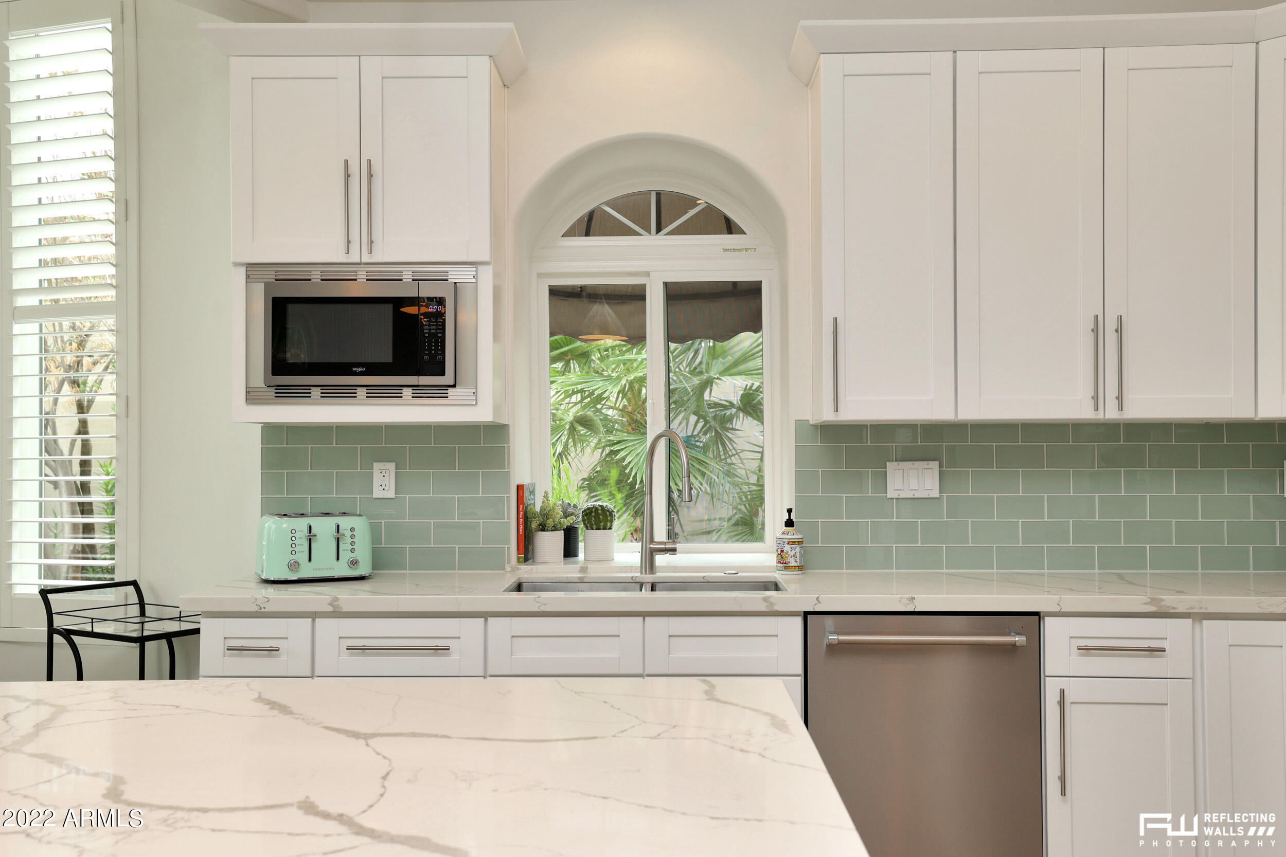 10085 East Doubletree Ranch Road Scottsdale, AZ 85258 - Photo 22 of 62 a kitchen with a sink and a microwave