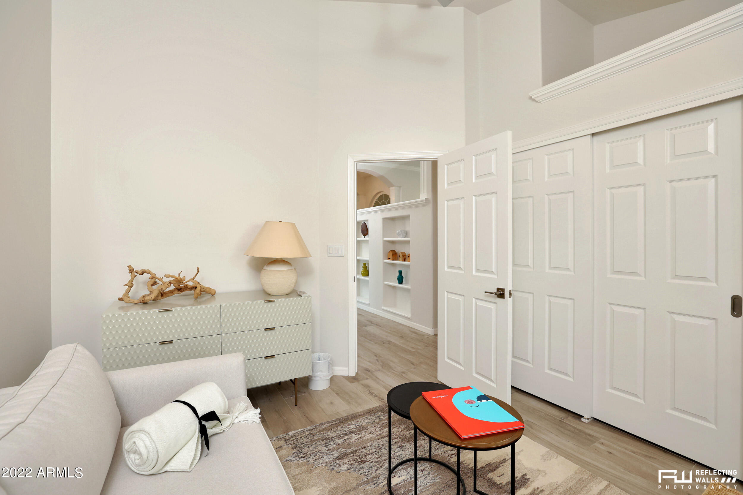 10085 East Doubletree Ranch Road Scottsdale, AZ 85258 - Photo 29 of 62 a bedroom with a bed and a chandelier