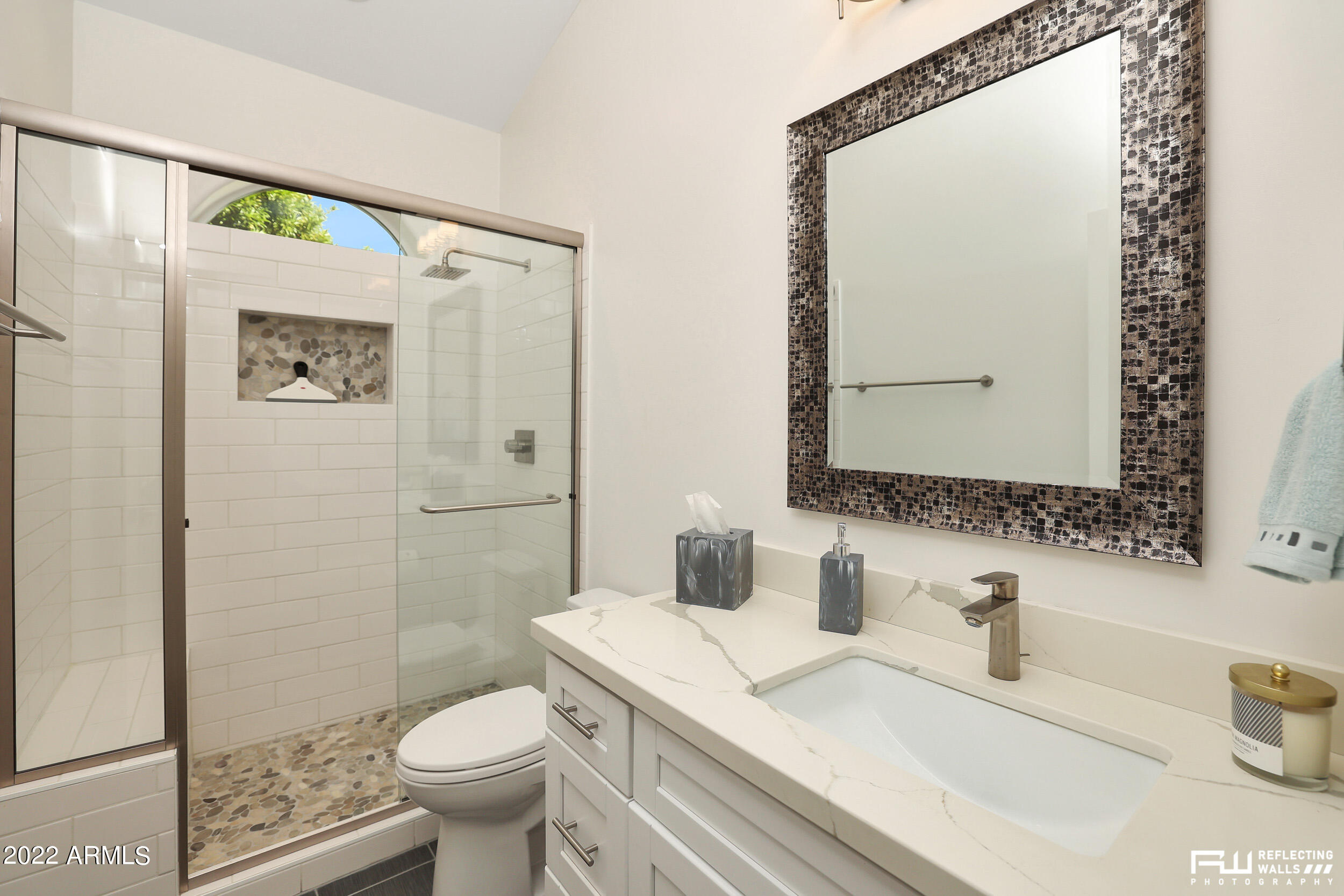 10085 East Doubletree Ranch Road Scottsdale, AZ 85258 - Photo 30 of 62 a bathroom with a sink a toilet and a mirror