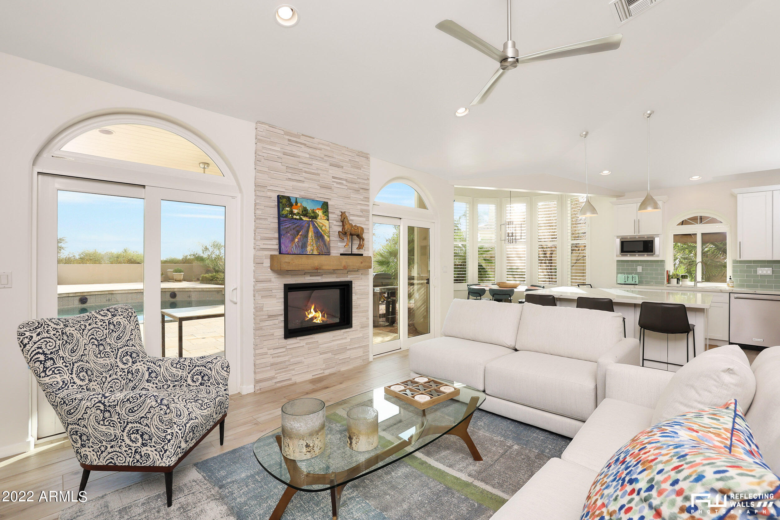 10085 East Doubletree Ranch Road Scottsdale, AZ 85258 - Photo 6 of 62 a living room with furniture fireplace and a large window
