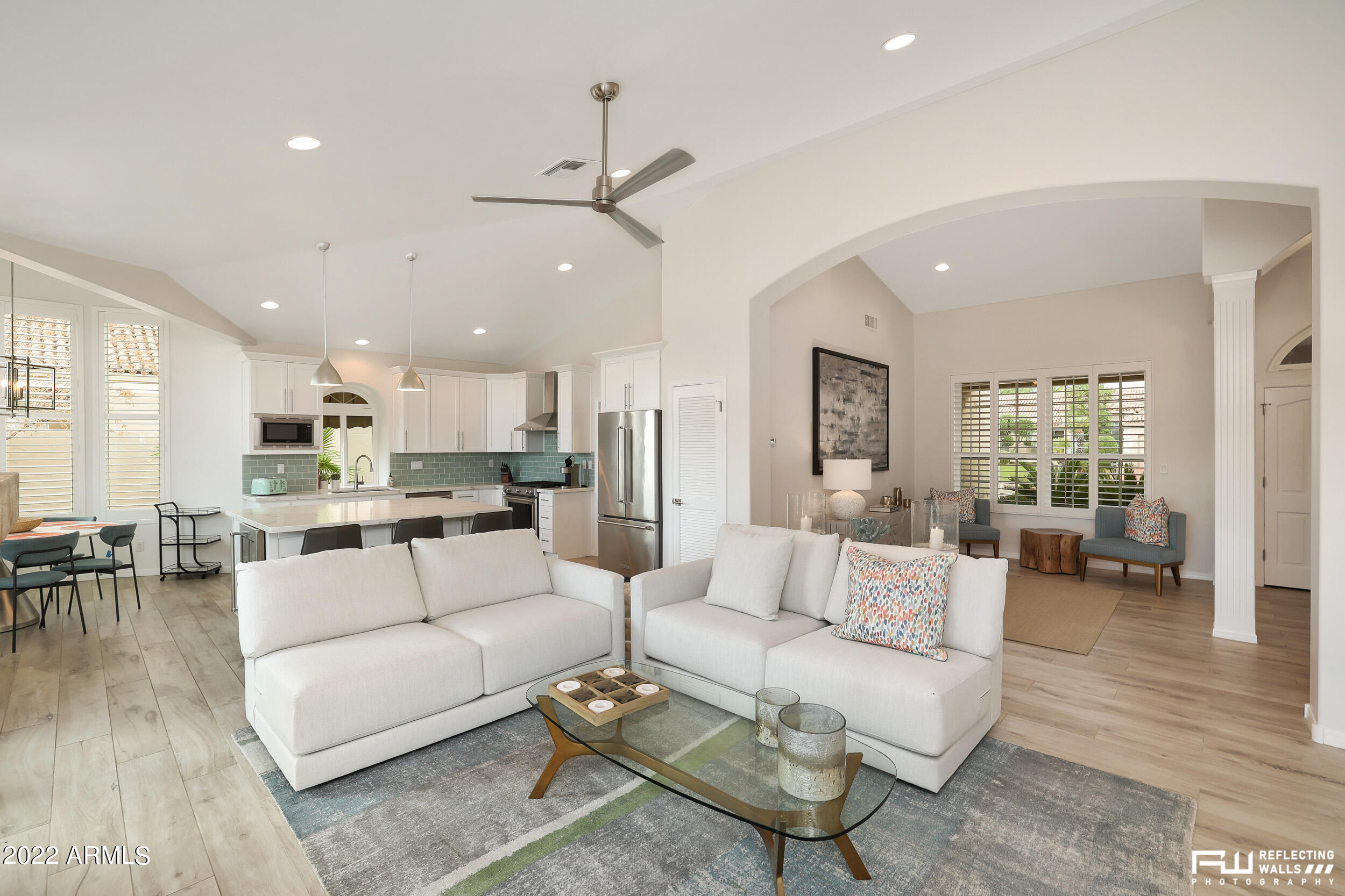 10085 East Doubletree Ranch Road Scottsdale, AZ 85258 - Photo 10 of 62 a living room with furniture kitchen view and a wooden floor
