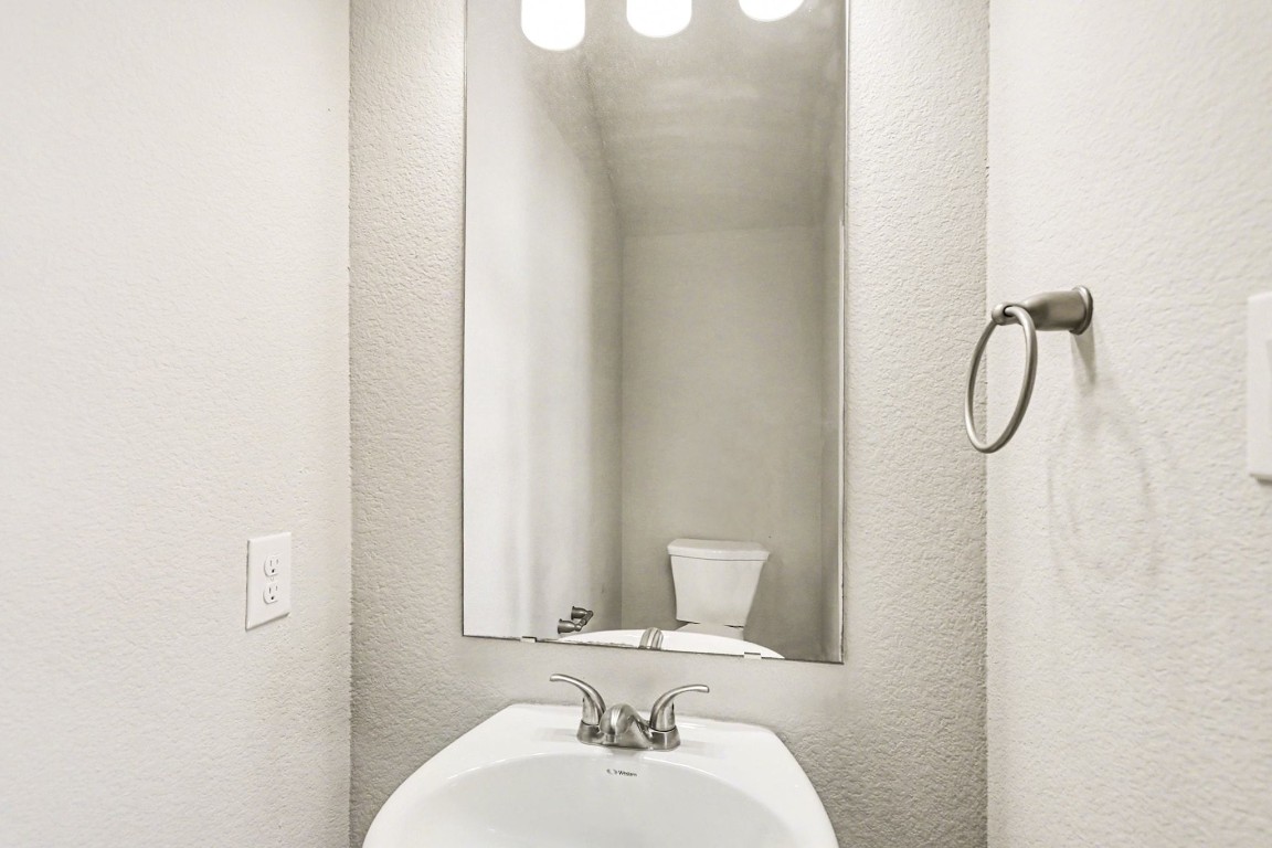 19602 Pradera Meadows Loop Rosharon, TX 77583 - Photo 13 of 47 a bathroom with a sink vanity and a mirror