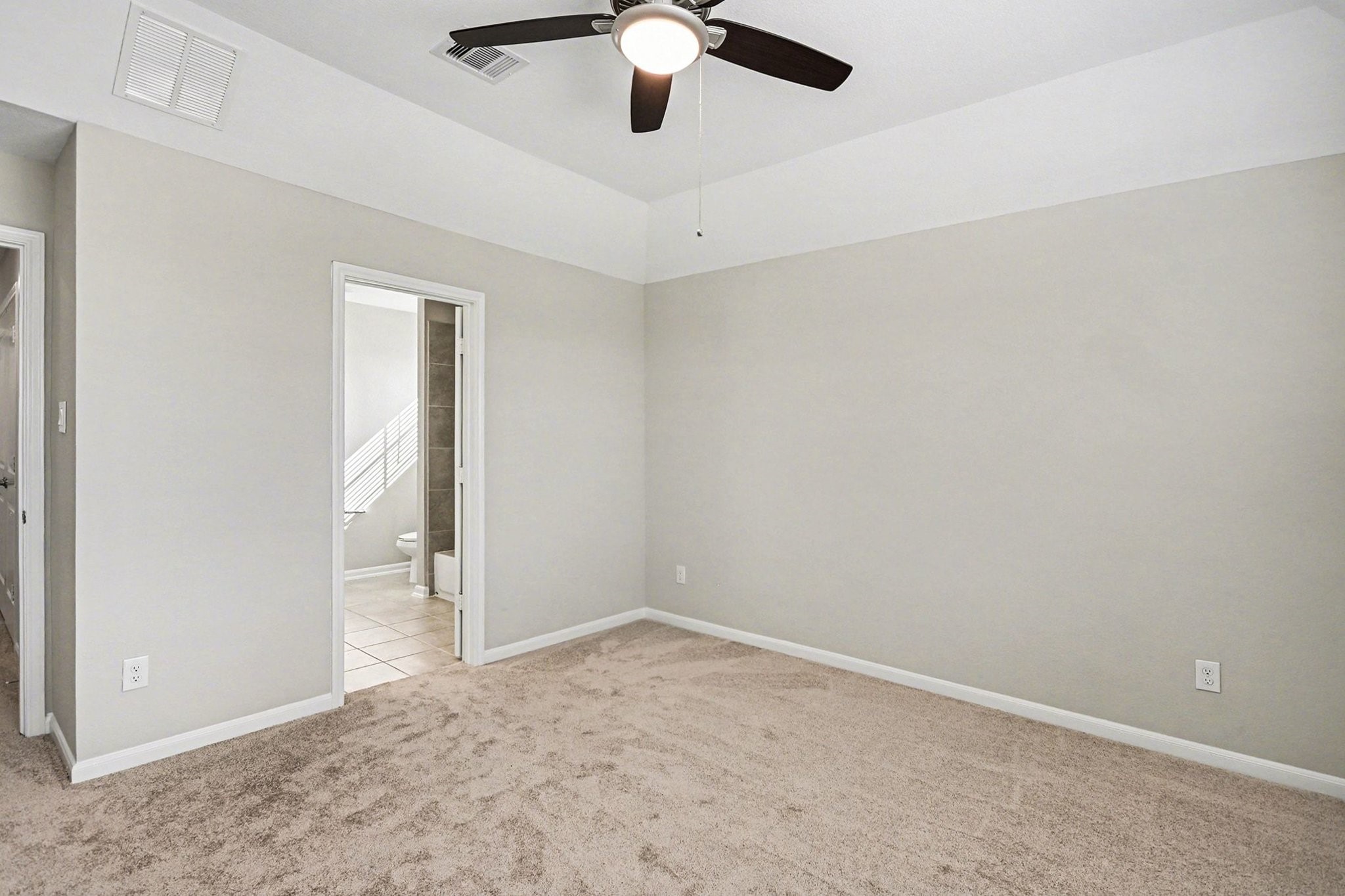 19602 Pradera Meadows Loop Rosharon, TX 77583 - Photo 22 of 47 an empty room with a ceiling fan and carpet