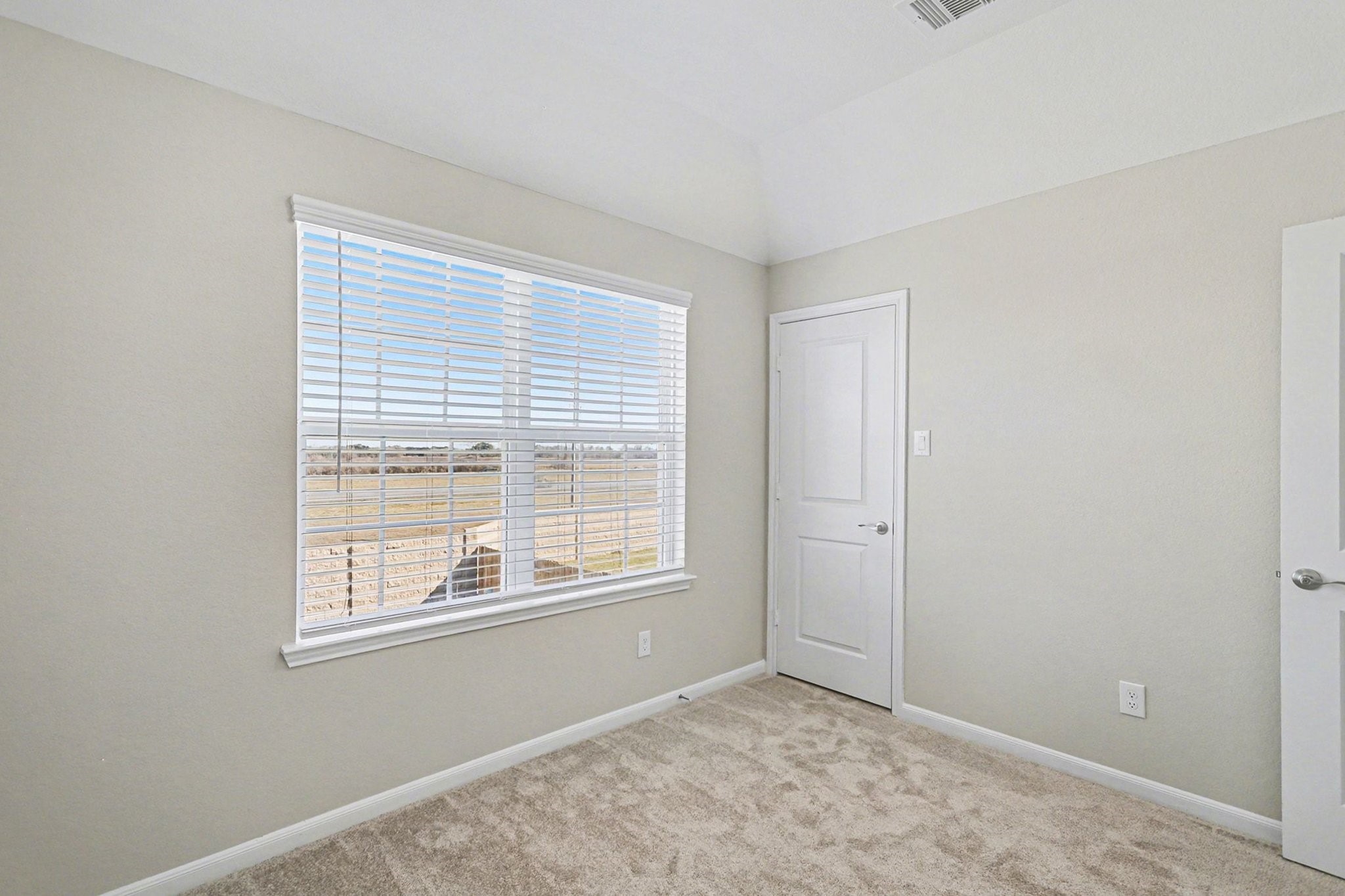 19602 Pradera Meadows Loop Rosharon, TX 77583 - Photo 23 of 47 a view of an empty room with a window