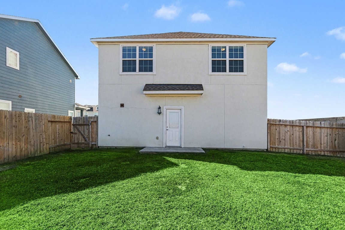 19602 Pradera Meadows Loop Rosharon, TX 77583 - Photo 30 of 47 a backyard of a house with lots of green space
