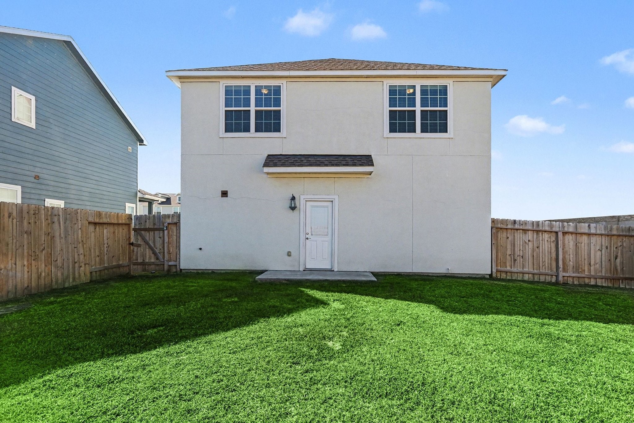 19602 Pradera Meadows Loop Rosharon, TX 77583 - Photo 30 of 47 a backyard of a house with lots of green space