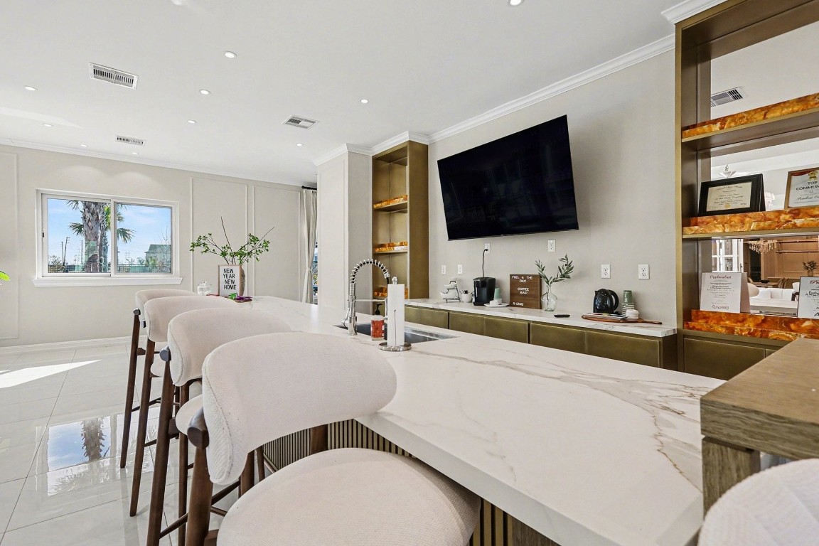 19602 Pradera Meadows Loop Rosharon, TX 77583 - Photo 41 of 47 a living room with stainless steel appliances furniture a flat screen tv and a refrigerator