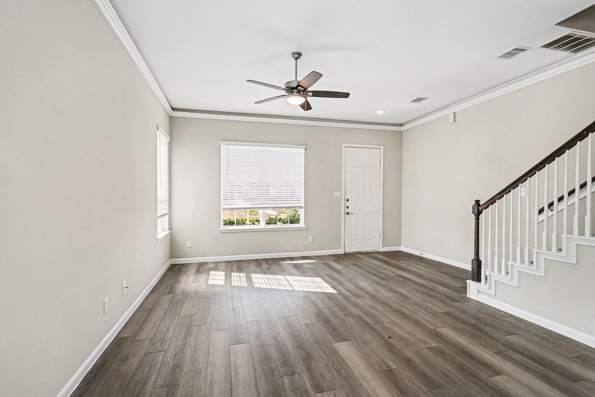19602 Pradera Meadows Loop Rosharon, TX 77583 - Photo 5 of 47 wooden floor in an empty room with a window