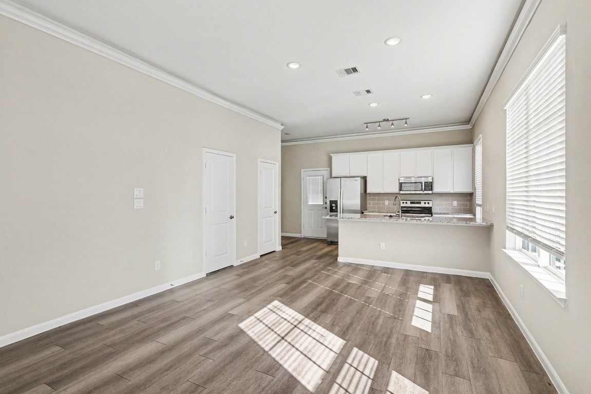 19602 Pradera Meadows Loop Rosharon, TX 77583 - Photo 9 of 47 a view of kitchen with cabinets and wooden floor
