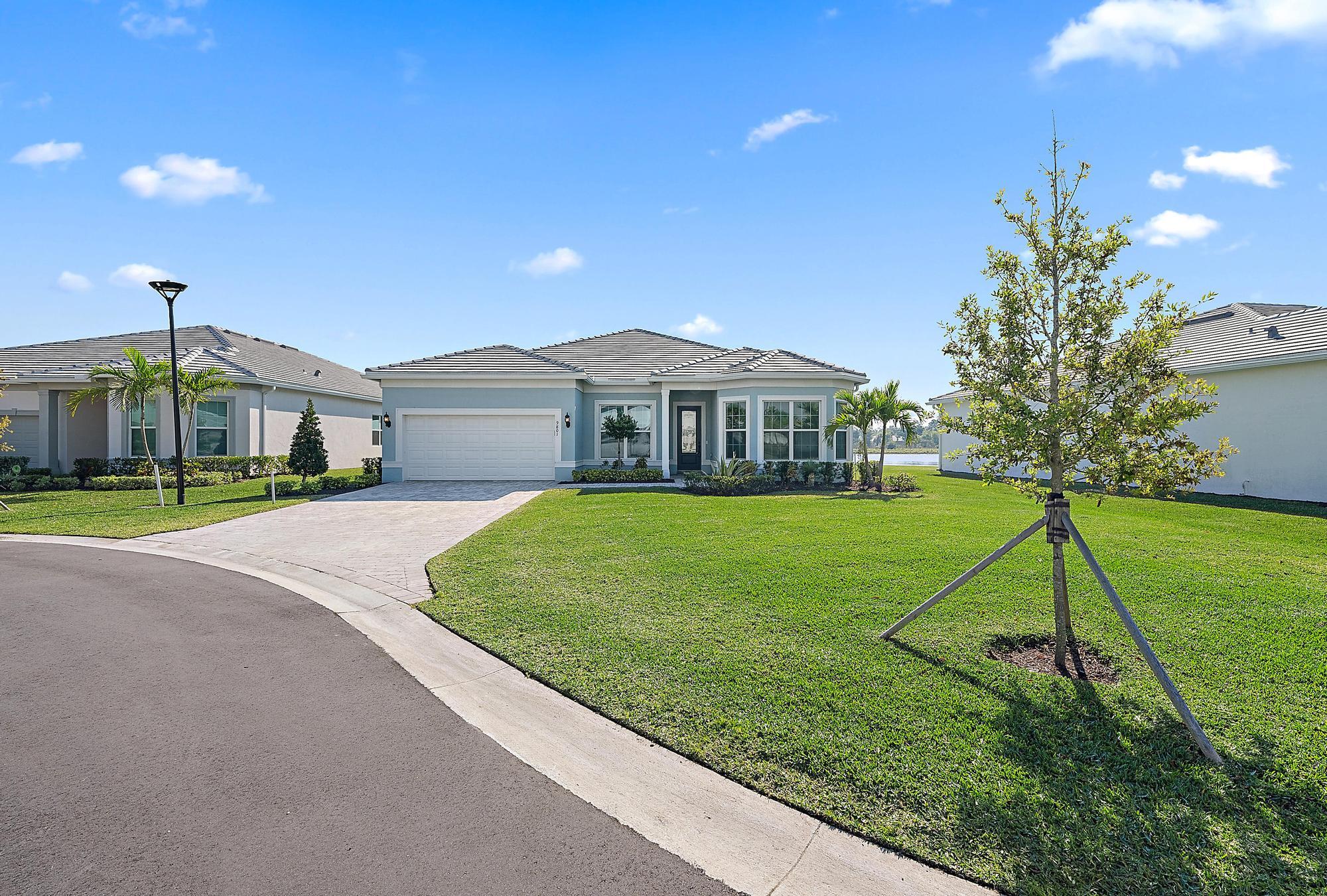 9801 Southwest Legacy Drive Stuart, FL 34997 - Photo 1 of 46 a view of house with a yard