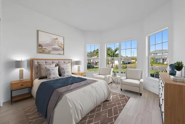 a bedroom with a large bed and a couch