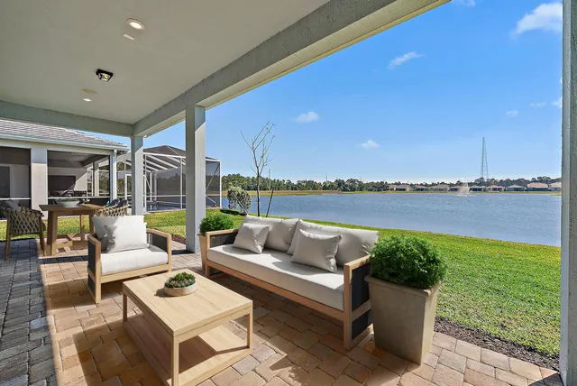 a roof deck with couches and city view