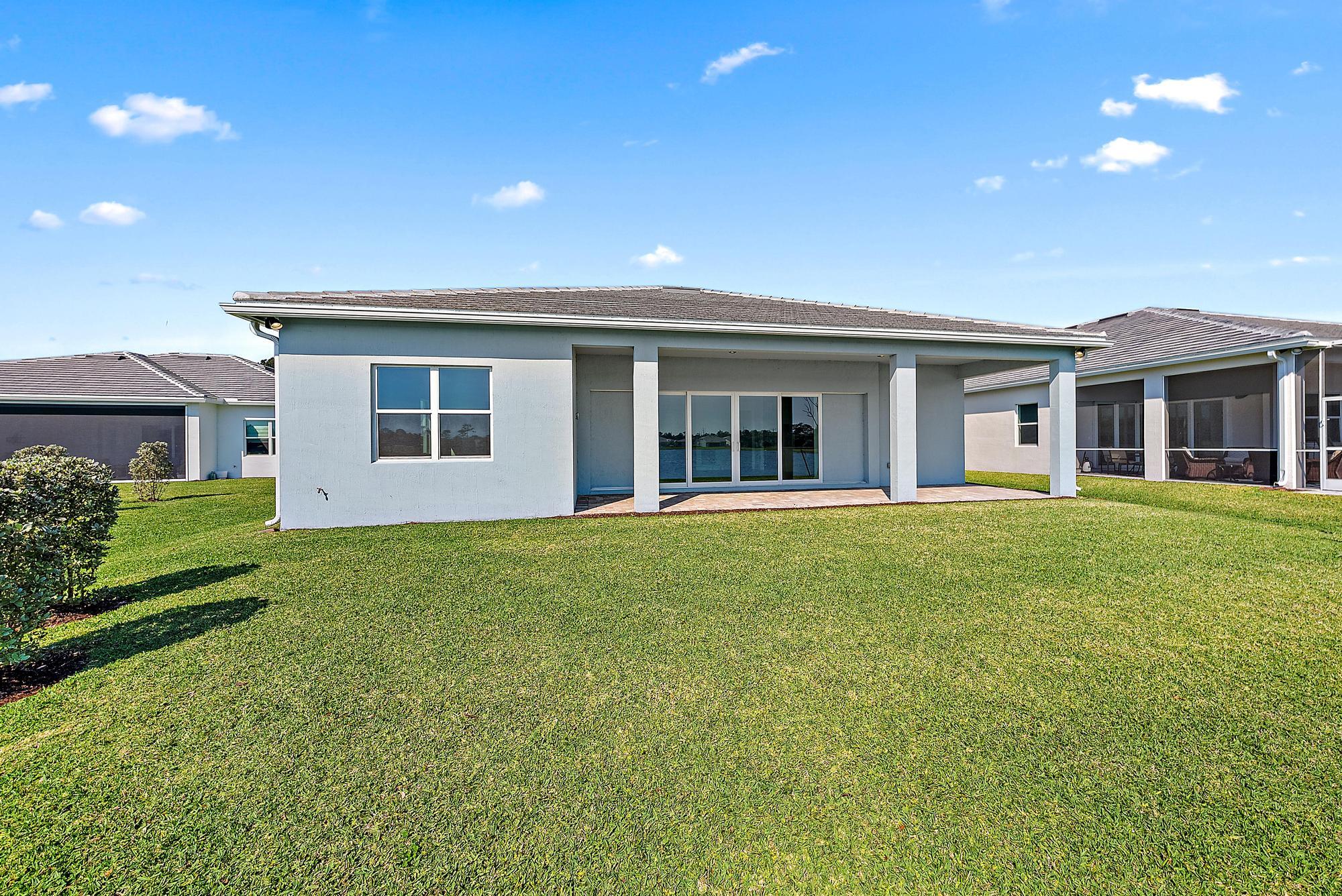 9801 Southwest Legacy Drive Stuart, FL 34997 - Photo 35 of 46 a view of a house with a backyard
