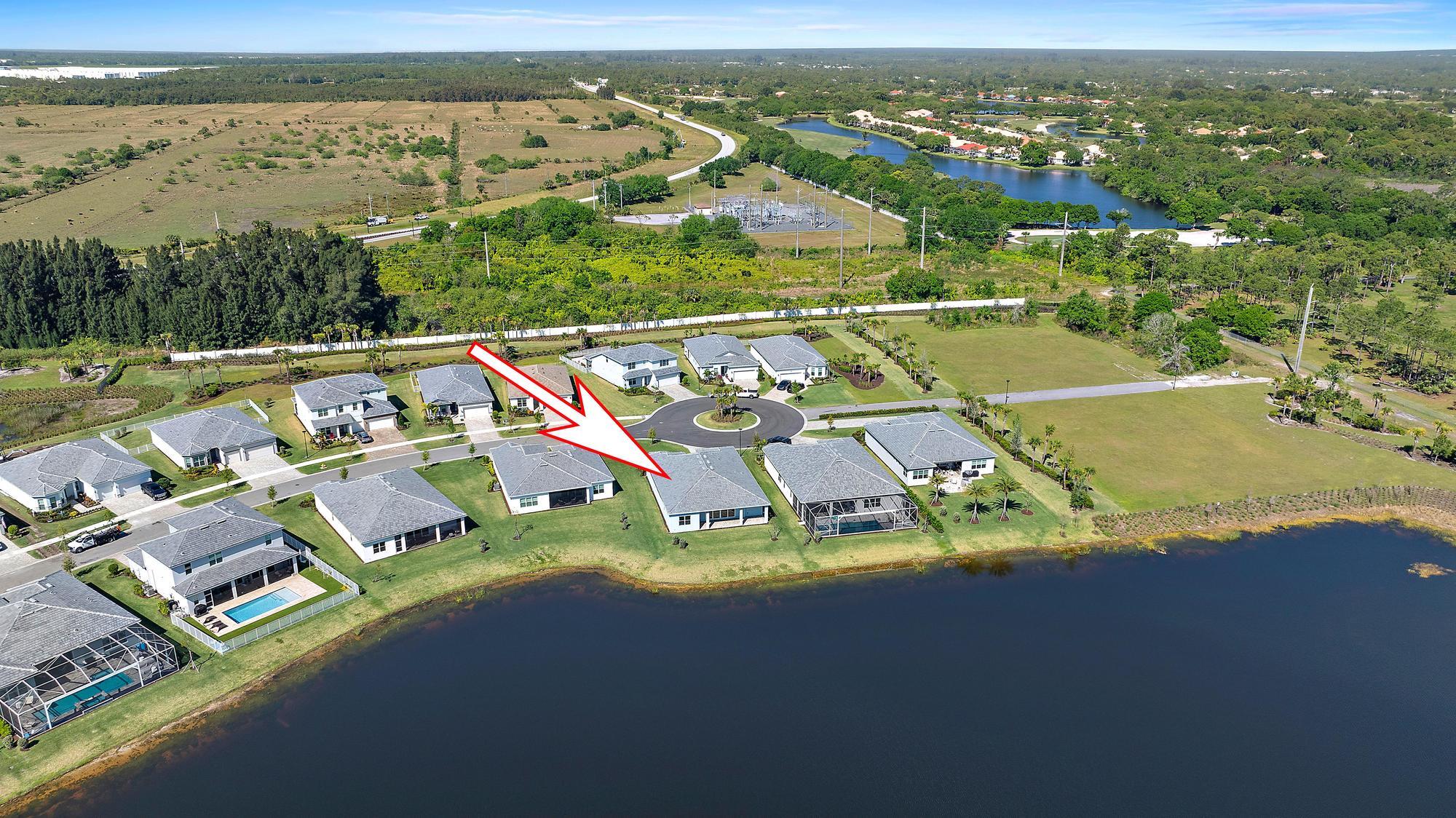 9801 Southwest Legacy Drive Stuart, FL 34997 - Photo 46 of 46 an aerial view of residential houses with outdoor space and ocean view