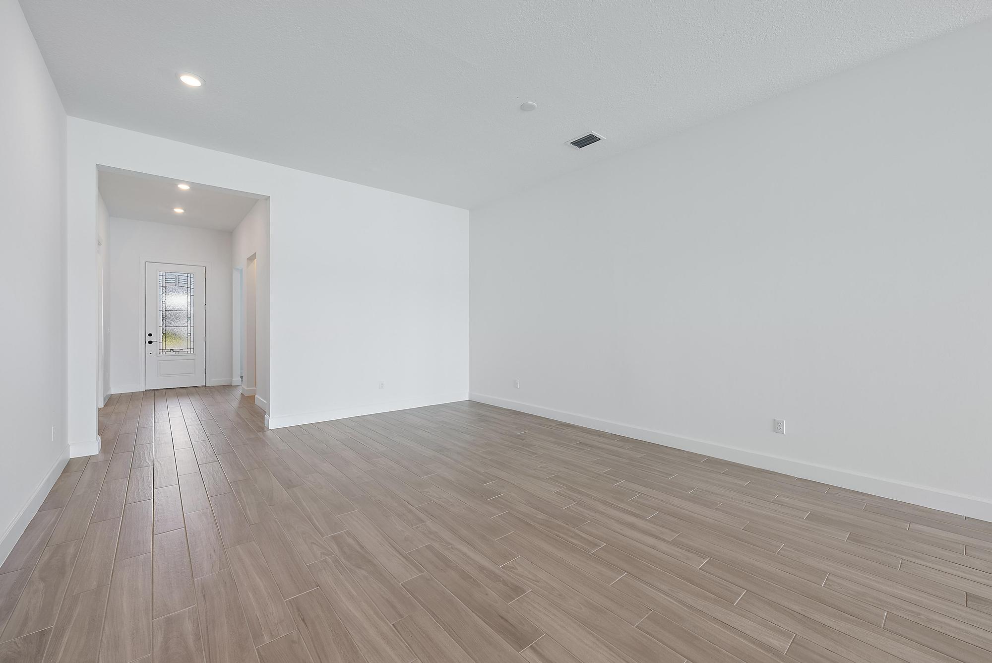 9801 Southwest Legacy Drive Stuart, FL 34997 - Photo 5 of 46 a view of an empty room and wooden floor