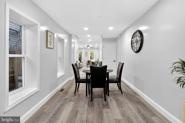a view of a dining room with furniture and a window
