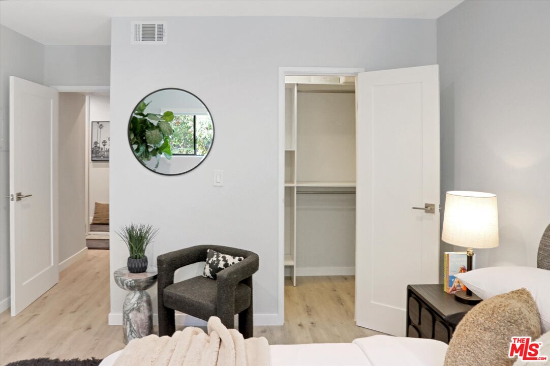 7300 Franklin Avenue, Unit 346 Los Angeles, CA 90046 - Photo 16 of 22 a living room with furniture and a window