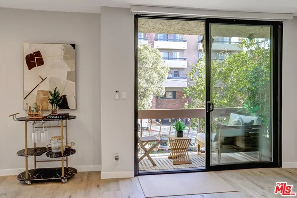 a room with gym equipment and a large window