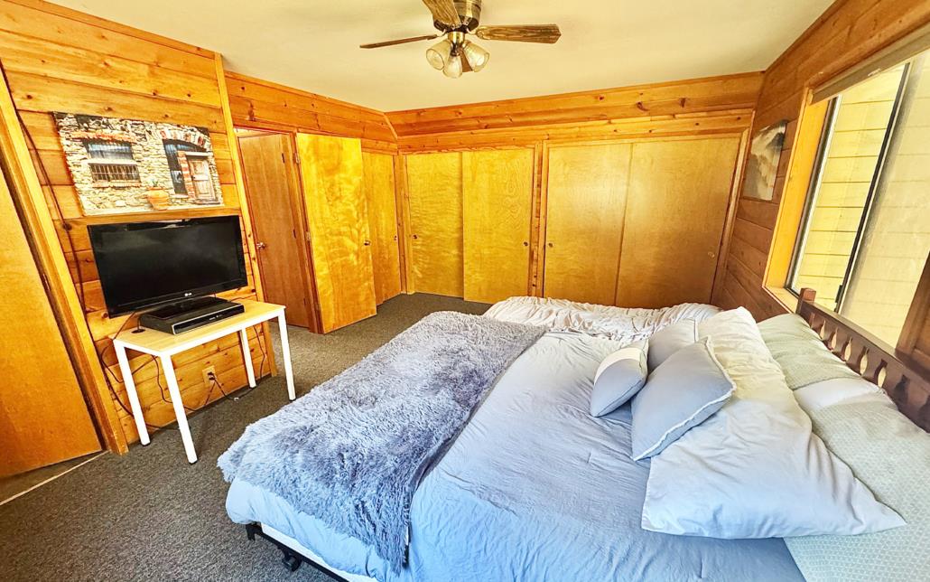 6330 Caldor Road Somerset, CA 95684 - Photo 15 of 30 a bedroom with a bed and a flat tv screen